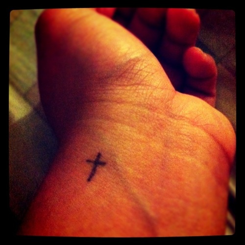 Tiny & simple Christian cross tattoo on wrist