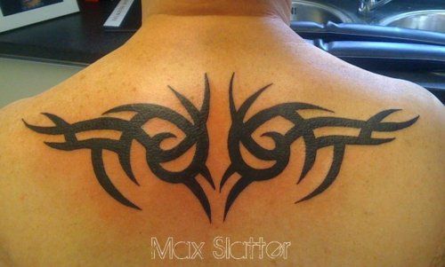 Black upper back tribal tattoo