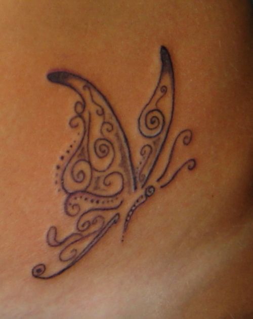 Black musical butterfly tattoo
