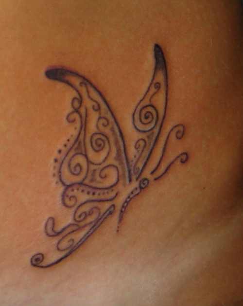 Black musical butterfly tattoo