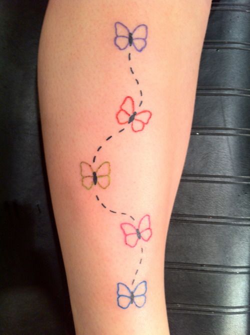 Colorful leg butterflies tattoo