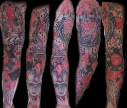 Black and red full sleeve tattoo w. skulls and poker scene