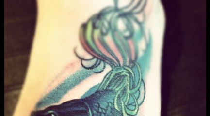 Colorful betta fish foot tattoo