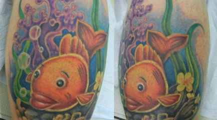 Colorful cartoon goldfish leg tattoo