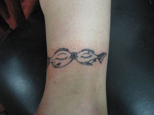 Cute kissing fish ankle tattoo