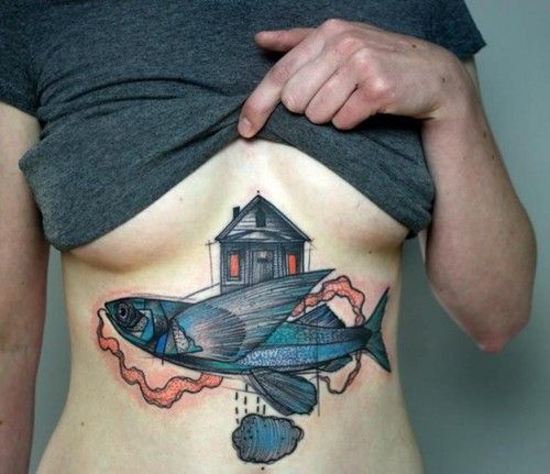 Flying fish tattoo on girls stomach
