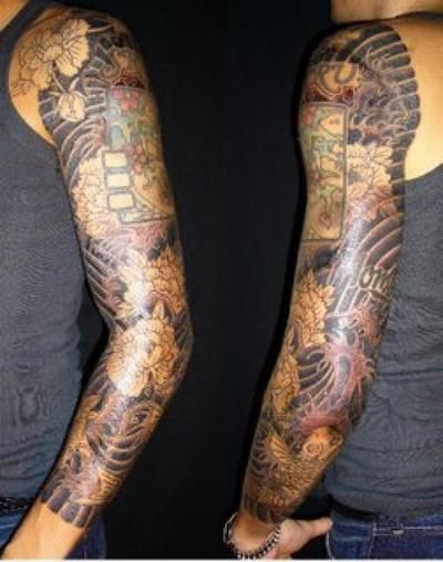 Full sleeve tattoo with hibiscus, Japanese patterns, and koi