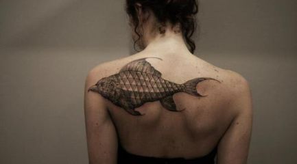 Girls back shoulder bird fish tattoo