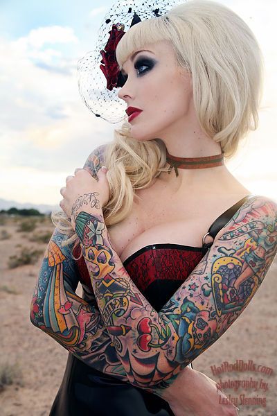 Girls colorful full sleeve tattoos w/ just about everything