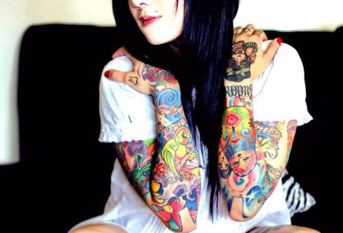 Girls colorful sleeve tattoos w. a little of everything