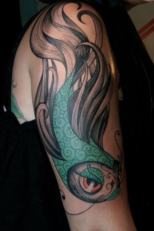 Girly female fish arm tattoo
