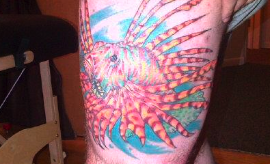Guys lion fish leg tattoo