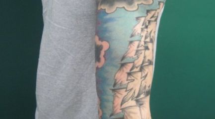 Guys nautical scene full sleeve tattoo