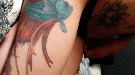 Large blue and red betta fish thigh tattoo