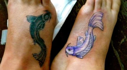 Matching Japanese fish foot tattoos