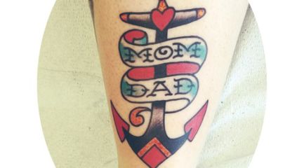 Mom and Dad anchor tattoo on leg