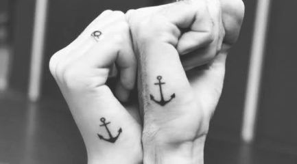 Simple black anchor tattoos on hands