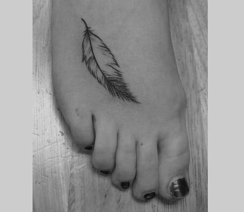 Small simple feather tattoo outline on girls foot