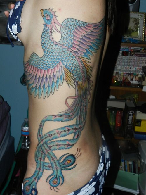 Blue and purple phoenix tattoo on girls side