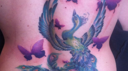 Blue phoenix tattoo with purple butterflies