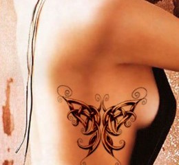 Celtic knot butterfly tattoo on girls side