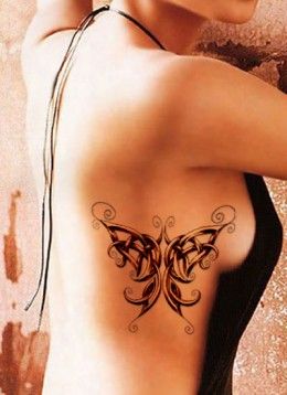 Celtic knot butterfly tattoo on girls side