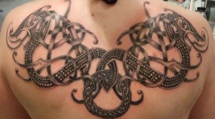 Celtic knots and dragons tattoo on guys back