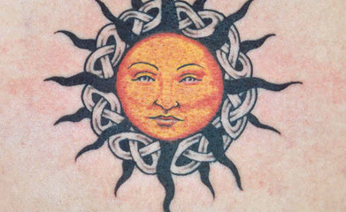 Celtic sun and knots back tattoo