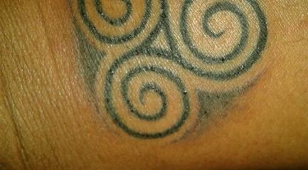 Celtic trinity swirls tattoo
