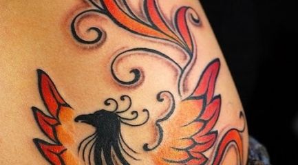 Cute phoenix tattoo on girls hip