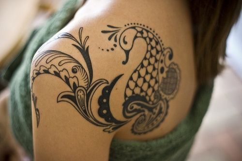 Cute phoenix tattoo on girls shoulder