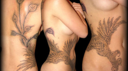 Girls black phoenix tattoo wrapping around her side