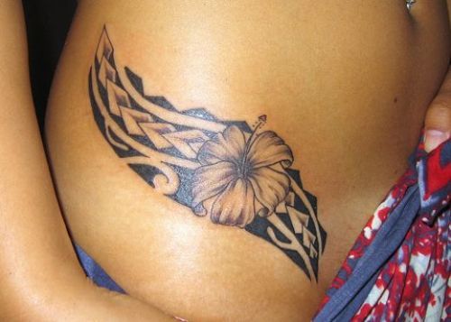 Girls Polynesian hibiscus tattoo on her hip
