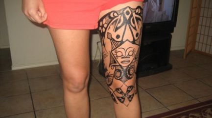 Girls Polynesian leg tattoo with female face