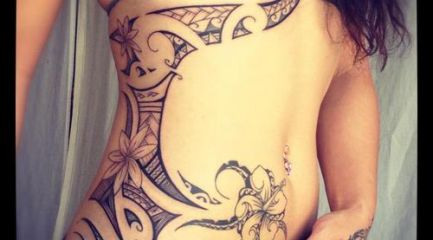 Girls side chest and hip Polynesian tattoo