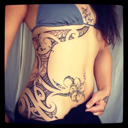 Girls side chest and hip Polynesian tattoo