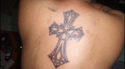Guys large Celtic cross back tattoo