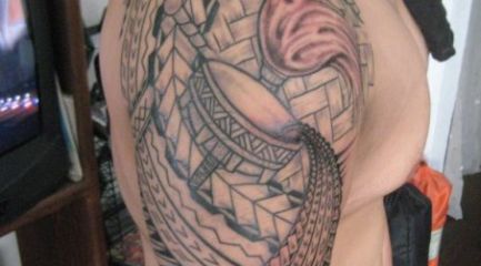 Guys Polynesian half sleeve tattoo with torch and flower
