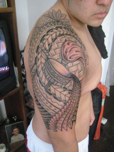 Guys Polynesian half sleeve tattoo with torch and flower