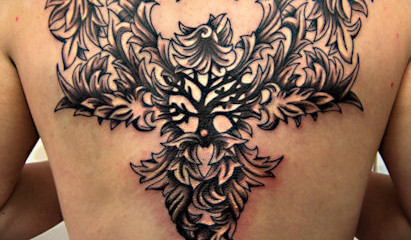 Intricate phoenix tattoo with tree of life