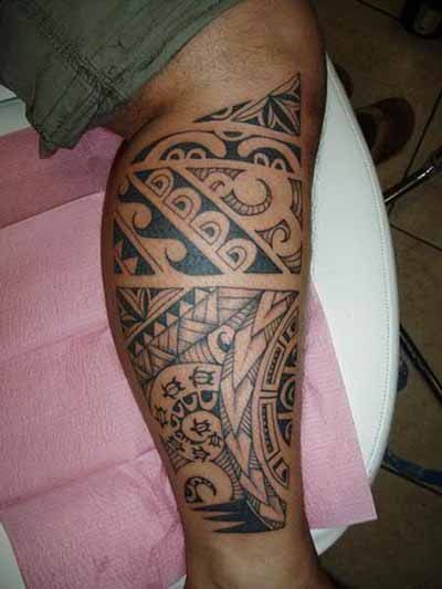 Polynesian leg tattoo with sea turtles and waves