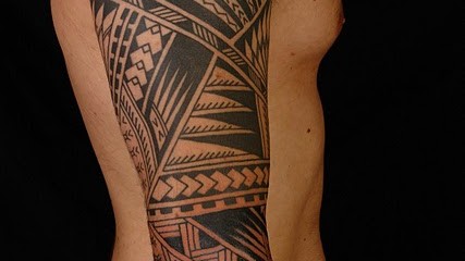 Polynesian three-quarter tribal sleeve tattoo