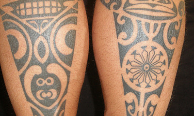 Polynesian tribal calf tattoos