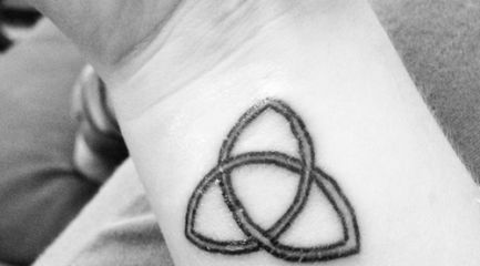 Simple Celtic triquetra wrist tattoo