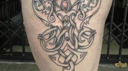Tribal Celtic dragon tattoo on leg