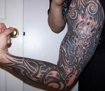 Tribal Celtic full sleeve tattoo with skull