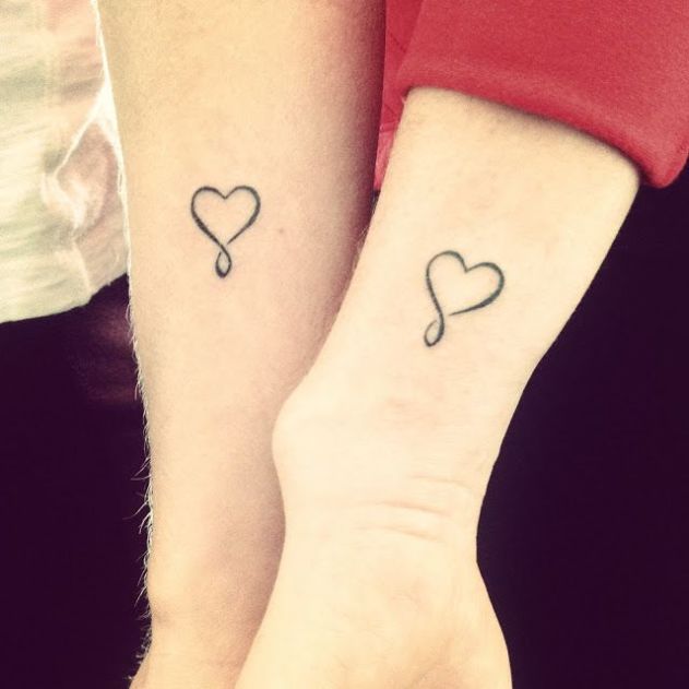 Couples heart & infinity symbol tattoos on arms