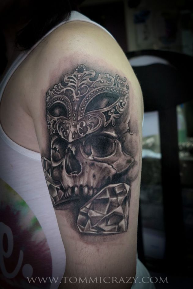 Huge skull tattoo w/ masquerade mask &amp; diamonds on guy's arm